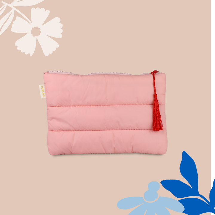 Pink padded puffer-style travel bag with modern, lightweight design on a light background.